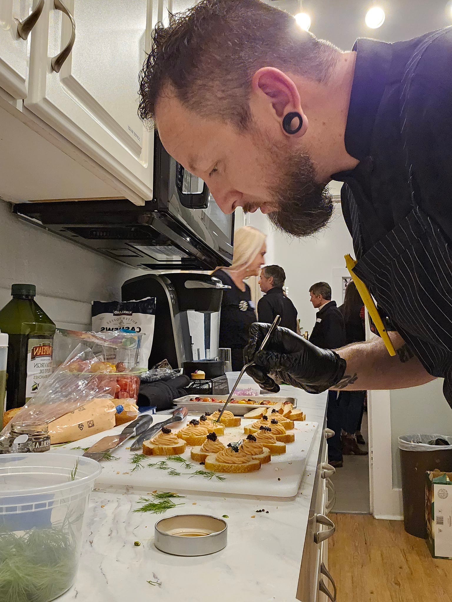 Chef Pete carefully preparing gourmet appetizers for a private event